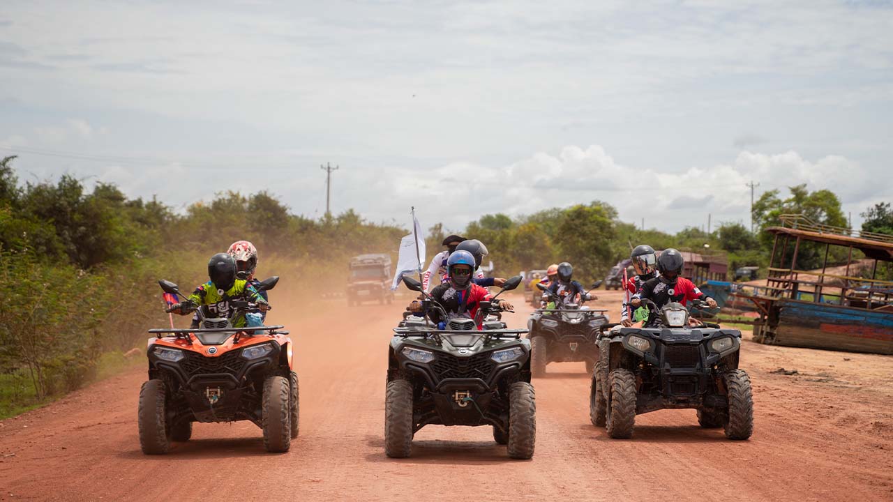 Quad bike riding in countryside fields